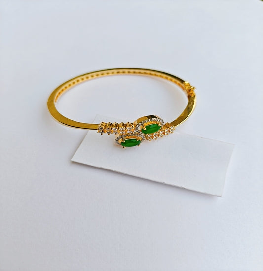 Classic Charm Gold-toned American Diamond Bracelet with Emerald Green Gemstones