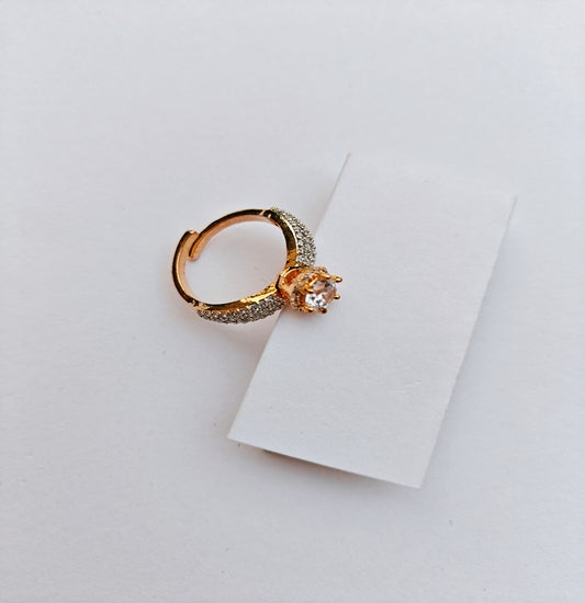 Elegant Gold-Toned Solitaire Ring with Sparkling American Diamonds