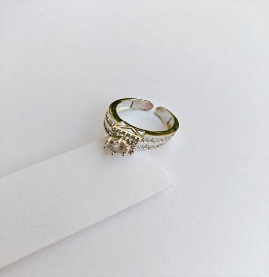 Silver-Toned American Diamond Solitaire Ring with Sparkling Side Stones