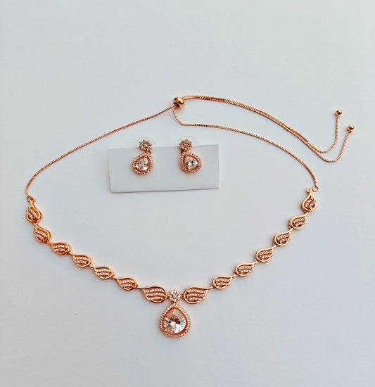 Wave-Pattern Rose Gold-toned American Diamond Necklace with Statement Teardrop Pendant & Earrings Set